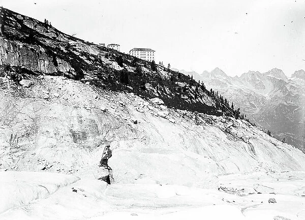 Switzerland: A woman climbs a summit over a glacier, 1895