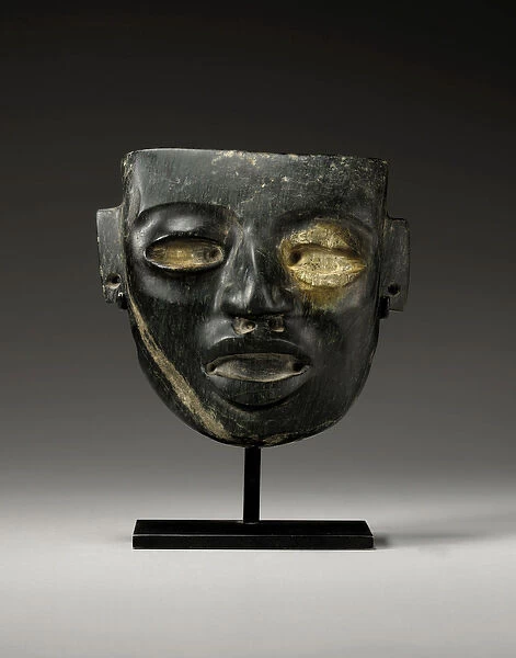 A Teotihuacan stone mask, carved with the youthful face of a dignitary, c. 450-650 (stone)
