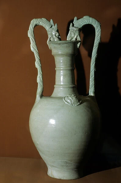 Vase with white glaze, double dragon handles, decorated with flowers in relief