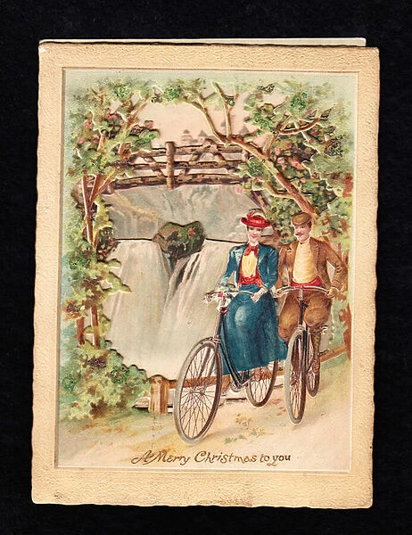 A Victorian three dimensional Christmas card of a man and a woman bicyling next to a