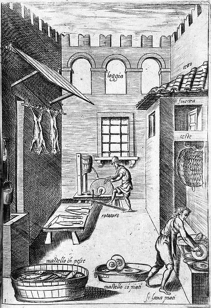 View of a kitchen. At the bottom, a man sharpenes the knives while in front of another