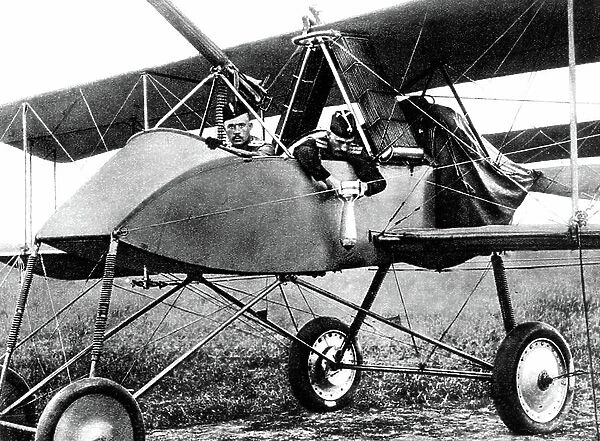 War technic : on russian armoured plane the pilote is accompanied by officer dropping bombs 1916