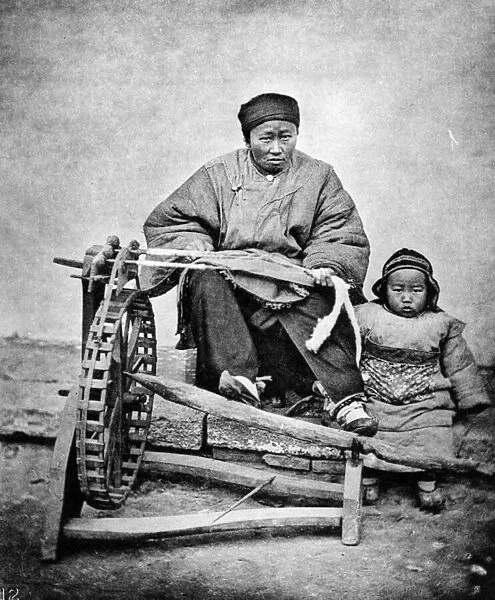 Woman and Child with Spinning Wheel, c. 1870s (b  /  w photo)