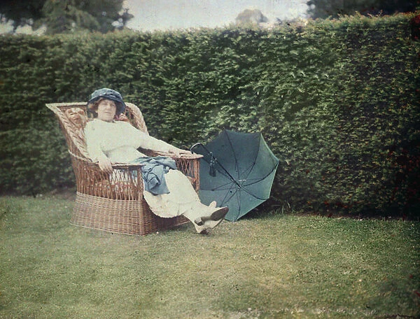 Woman sitting in a garden chair (autochrome)