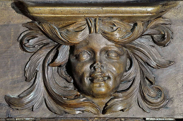 Woman's head Boiseries of the 17th century Detail of the stalls of the church of the Clunisian Prieure Sainte-Marie (Sainte Marie) founded in the 11th century, Moirax, Lot et Garonne