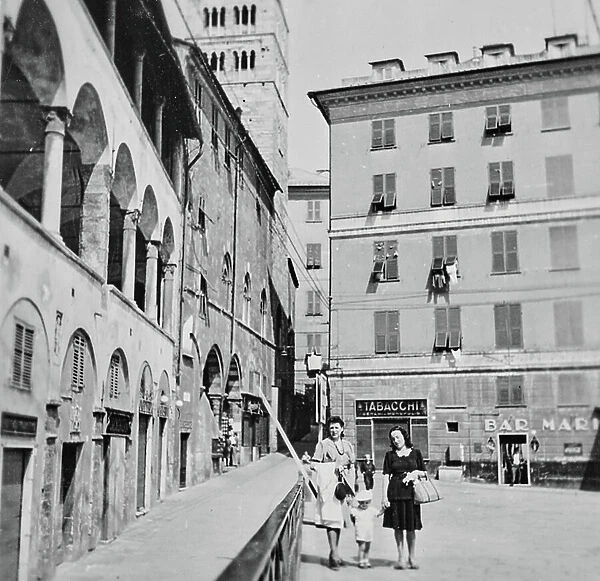 Two women with a baby in Piazza San Giovanni, Genoa
