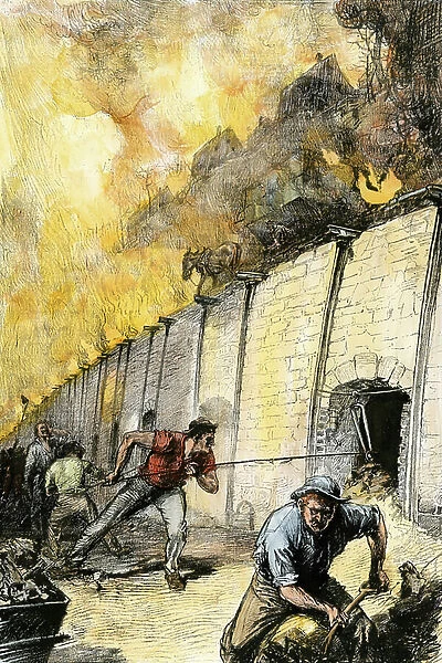 Worker working in the coke ovens of the Pittsburgh steel industry rising the workers city above, 1880. Colour engraving of the 19th century