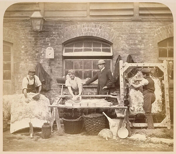 Workers making sheepskin rugs, c. 1861-62 (sepia photo) (see also 221845)