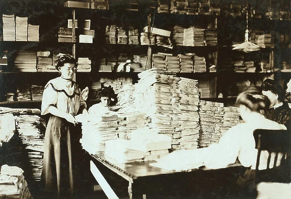 Young women sorting papers in a storeroom, c. 1905 (b  /  w photo)
