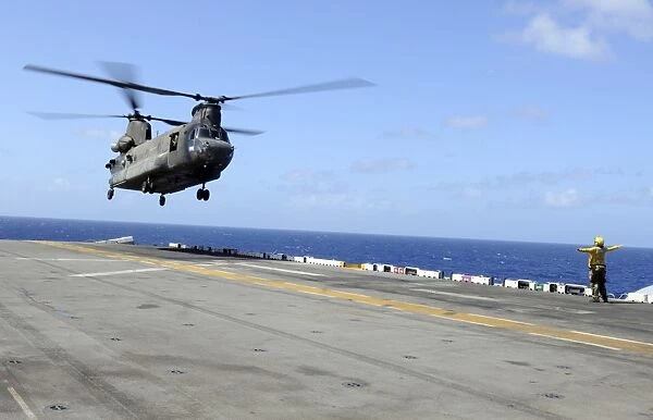 A CH-47 Chinook helicopter landing aboard USS Wasp