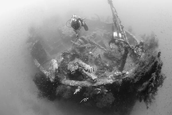 Divers explore the wreck of a Japanese Maru warship, Solomon Islands