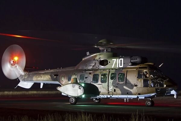 Eurocopter AS-532AL Cougar sits ready for a night flight