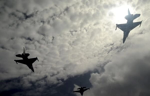 Three F-16 Fighting Falcons fly in formation over Guam