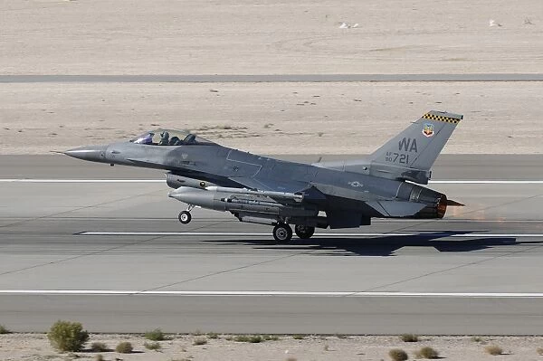 An F-16C Fighting Falcon taking off from Nellis Air Force Base