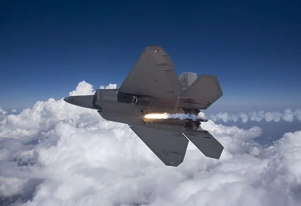 An F-22 Raptor releases a flare during a training mission