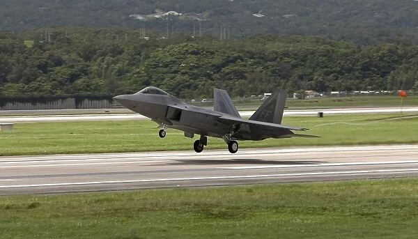 An F-22 Raptor takes off on a training mission from Kadena Air Base