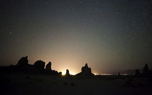 Large tufa formations at Trona Pinnacles against a backdrop of stars