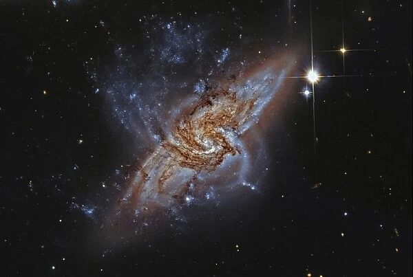 NGC 3314, a pair of overlapping spiral galaxies