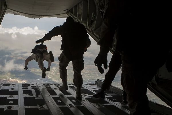 Paratroopers jump out of a KC-130J aircraft over Spain