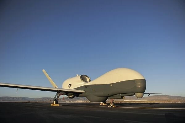 An RQ-4 Global Hawk unmanned aerial vehicle sits on the flight line