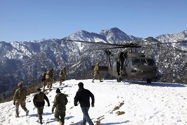 Soldiers board a U. S. Army UH-60 Black Hawk helicopter, Afghanistan