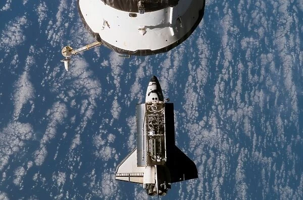 Space Shuttle Atlantis approaching the International Space Station