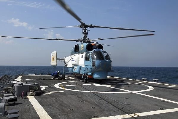 A Ukrainian Navy KA-27 Helix helicopter on the flight deck of USS Taylor