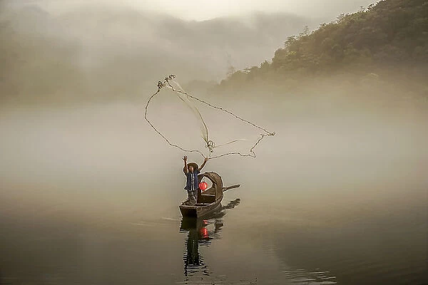 A Fisherman in the Morning Mist