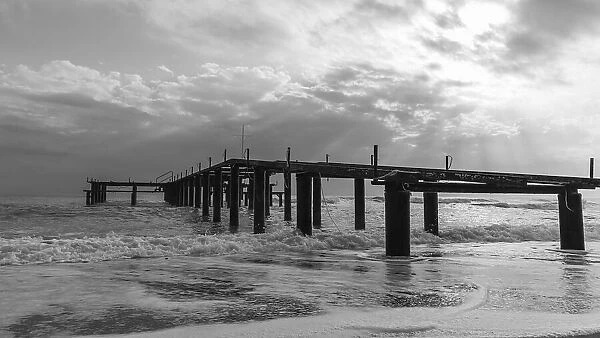 old pier and dramatic landscape