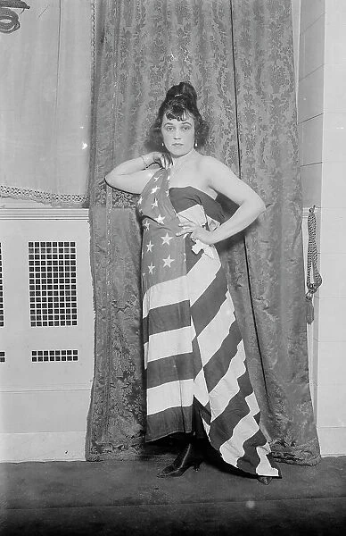 Alice Brady [draped in Old Glory], between c1915 and c1920. Creator: Bain News Service
