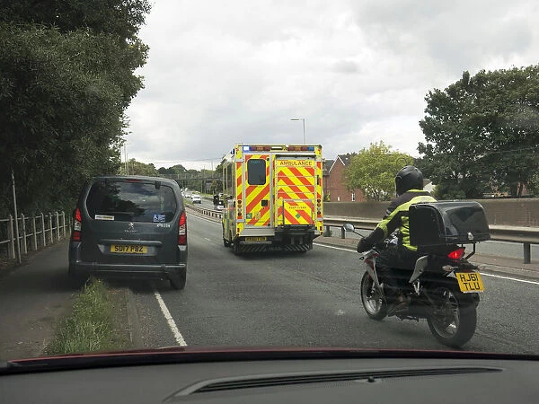 Ambulance attending road traffic accident, A35 Hampshire 2017. Creator: Unknown