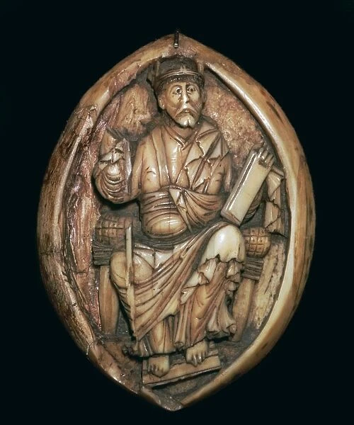 Anglo-Saxon carving of a man writing a book, 10th century