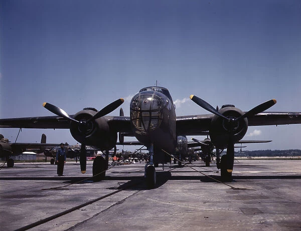 B-25 bombers on the outdoor assembly line at North American Aviation... Kansas City, Kansas, 1942. Creator: Alfred T Palmer