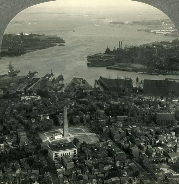 Bunker Hill Monument and Boston Harbor from the Air, Boston, Mass. c1930s. Creator: Unknown