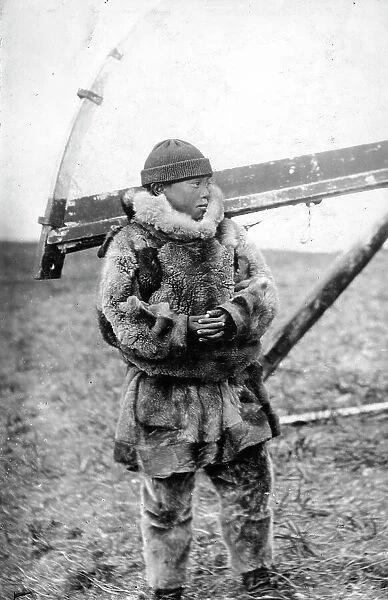 Chukchi boy in national clothes, kukhlyanka, fur pants, 1910-1929. Creator: Ivan Emelianovich Larin