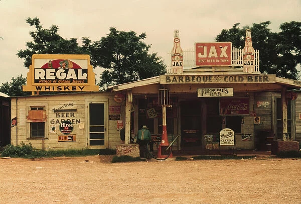 A cross roads store, bar, 'juke joint, 'and gas... in the cotton plantation area, Melrose, La. 1940. Creator: Marion Post Wolcott