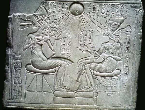 Egyptian relief of Akhenaten and Nefertiti holding their daughters, 14th century BC