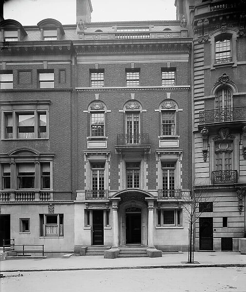 Four-story townhouse with curved pediment, possibly New York, N.Y. between 1900 and 1910. Creator: William H. Jackson