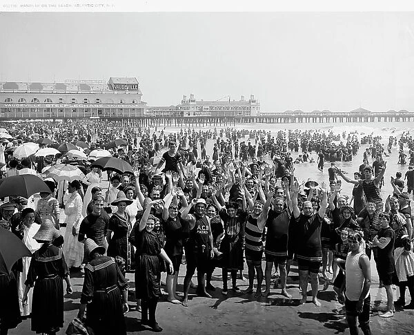 Hands up on the beach at Atlantic City, N.J. between 1900 and 1920. Creator: Unknown