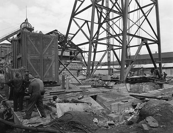 Installing a cage at Hickleton Main pit, Thurnscoe, South Yorkshire, 1961. Artist