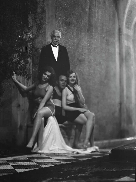 Kahn, Otto H. Mr. and unidentified women, outdoors, 1928 Creator: Arnold Genthe