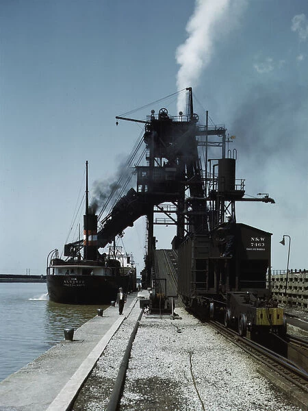 Loading a lake freighter with coal at the Pennsylvania R.R. coal docks... Sandusky, Ohio, 1943. Creator: Jack Delano