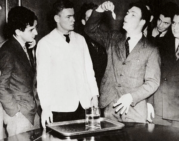 Lothrop Withington, Jr (right), a Harvard freshman, swallowing a goldfish, USA, 1935