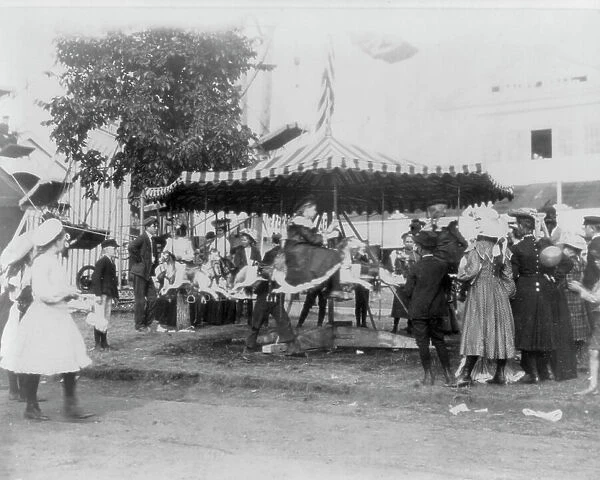 Minnesota State Fair: children on small merry-go-round, 1900?. Creator: Unknown