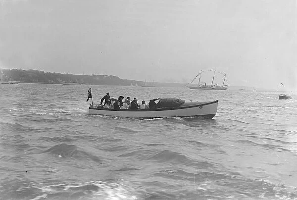 Modwenas motor launch with Modwena in the background, 1911. Creator: Kirk & Sons of Cowes