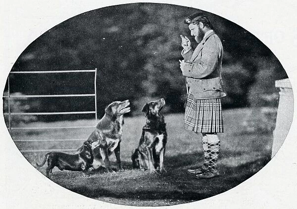 Mr. Francis Clark, The Queens Gillie, with three of her favourite dogs, c1899, (1901). Artist: GW Wilson and Company