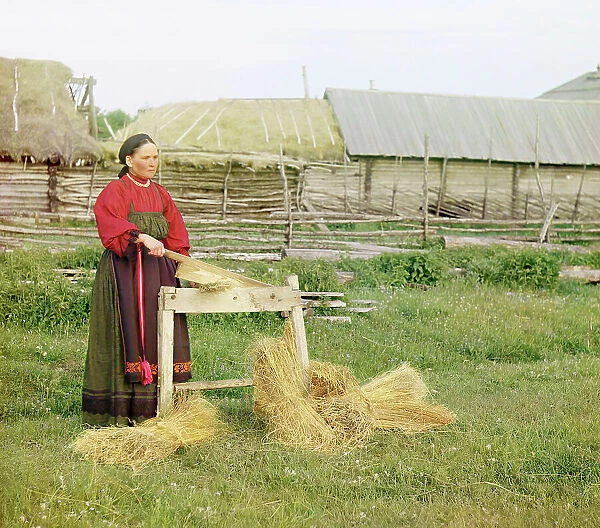 Peasant woman breaking flax;Perm Province, 1910. Creator: Sergey Mikhaylovich Prokudin-Gorsky