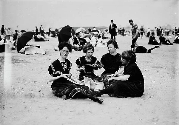 Picnicing on the beach, between 1900 and 1905. Creator: Unknown