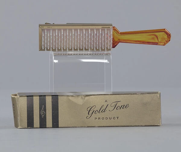 Plastic brush with box from Maes Millinery Shop, 1941-1994. Creator: Gold Tone