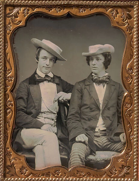 Two Seated Young Men Wearing Gingham Trousers, Bow Ties, and Brimmed, Soft Hats, 1850s